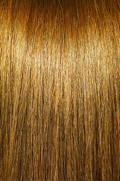 High quality natural looking human hair extensions in a warm golden blonde. Achieve real hair volume seamlessly.